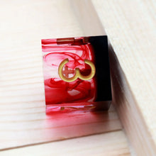 Load image into Gallery viewer, view of bloody, clotted looking dice